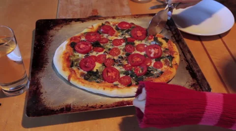 Slicing a homemade pizza Stock Footage 45499807