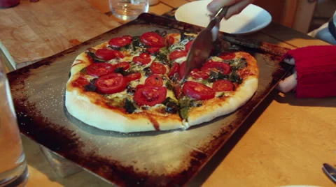 Slicing a homemade pizza Stock Footage 45500040