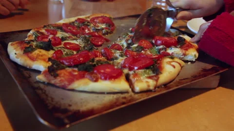 Slicing a homemade pizza Stock Footage 45500084