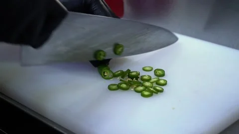 Slicing Jalapenos in a Professional Kitchen Stock Footage 319207789