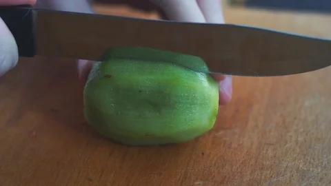 Slicing kiwi in slow motion Stock Footage 86682864