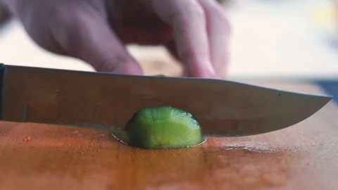 Slicing kiwi in slow motion Stock Footage 86682892