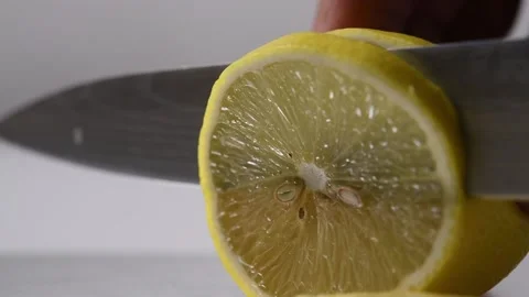 Slicing a lemon, close-up. Stock Footage 131978127