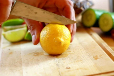 Slicing lemon Stock Footage