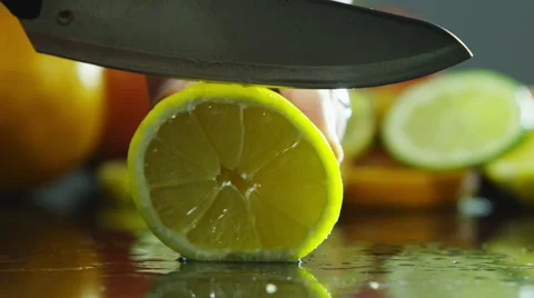 Slicing into a lemon Stock Footage 67359472