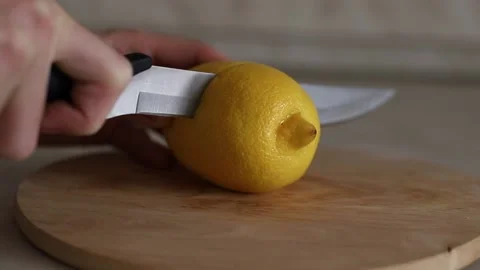 Slicing lemon. Stock Footage 143584354