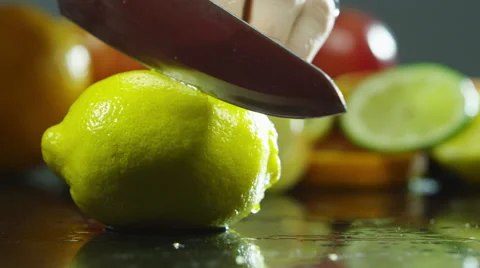 Slicing a lemon in half Stock Footage 67359442