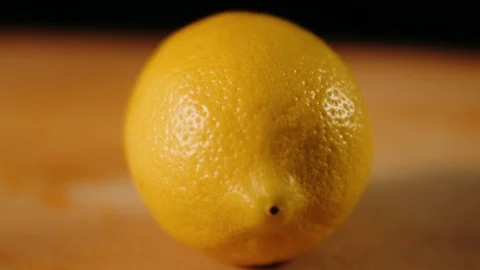 Slicing a lemon with the knife Stock Footage 125458588