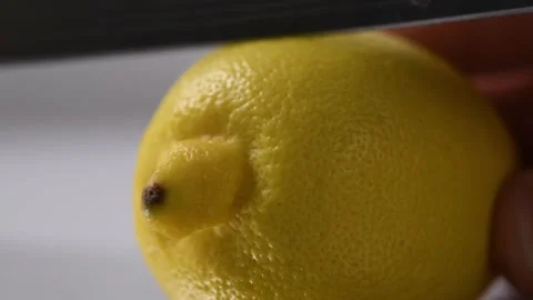 Slicing a lemon with a knife. Stock Footage 131978112