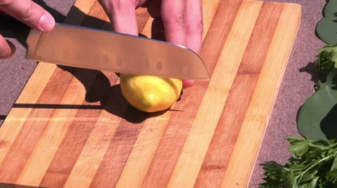 Slicing lemon outside Stock Footage 39908678