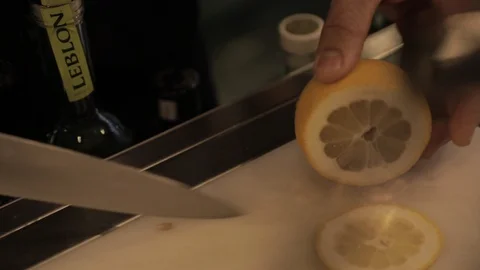 Slicing Lemon with Sharp Knive Stock Footage 129782286