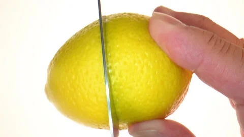 Slicing Lemon on white background  Stock Footage 285001121
