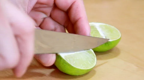 Slicing lime Stock Footage