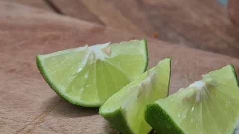 Slicing lime using a knife Stock Footage 314781516