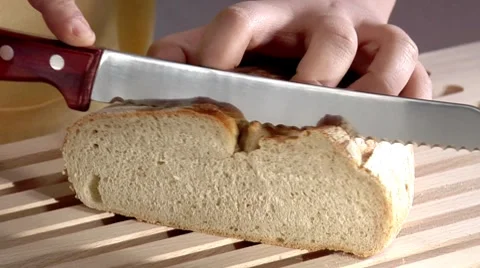 Slicing a loaf of bread Stock Footage 8573703