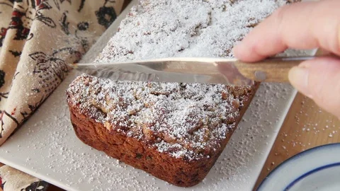 Slicing a loaf of zucchini bread Stock Footage 92536073