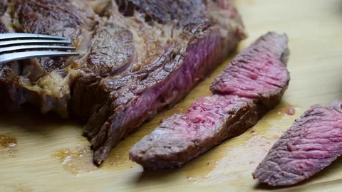 Slicing meadium rare stake close up selective focus Stock Footage 254873005