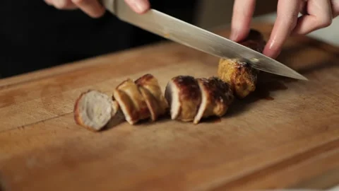 Slicing meat. Stock Footage 203896512