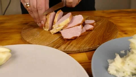 Slicing meat into large chunks Stock Footage 231159478