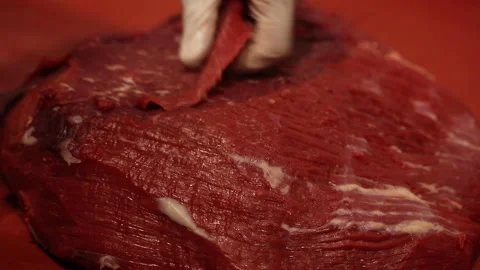 Slicing meat to prepare doner at a restaurant kitchen Stock Footage 145651772