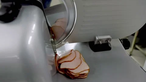 Slicing meat with a slicer Stock Footage 150027559