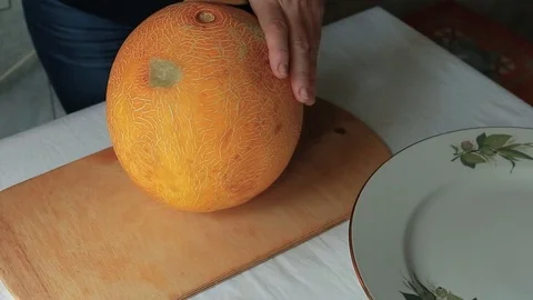 Slicing the melon to pieces Stock Footage 93520002