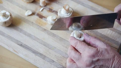 Slicing a mushroom with copy space Stock Footage 76089227
