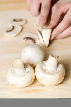 Slicing mushroom Stock Photos