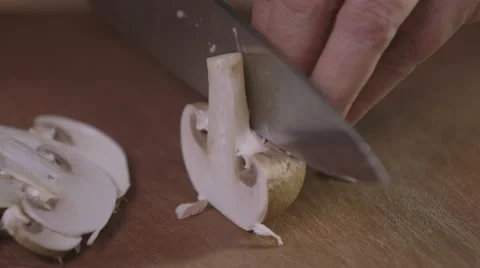 Slicing mushrooms; close-up Stock Footage 64029180