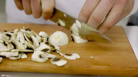 Slicing mushrooms with a knife Stock Footage 150551634