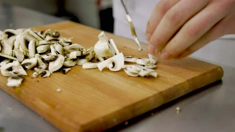 Slicing mushrooms with a knife Stock Footage 150683665
