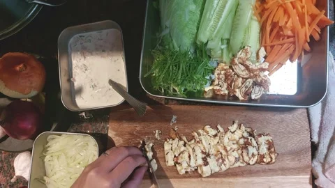 Slicing omelet and setting it aside along with the rest of the ingredients for m Stock Footage 318637144