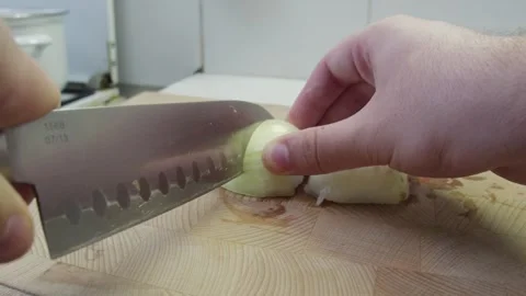 Slicing onion on a chopping board Stock Footage 286841567