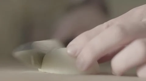Slicing onions, slow motion Stock Footage 56779524