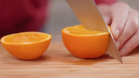 Slicing an Orange Half Close Up Video stock 155111995