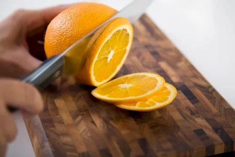 Slicing an orange Stock Photos