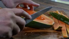 https://images.pond5.com/slicing-papaya-cutting-board-knife-footage-122454948_iconm.jpeg