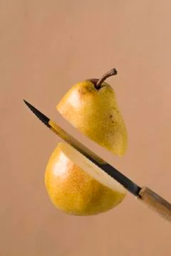 Slicing a pear Stock Photos