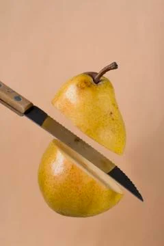 Slicing a pear Stock Photos