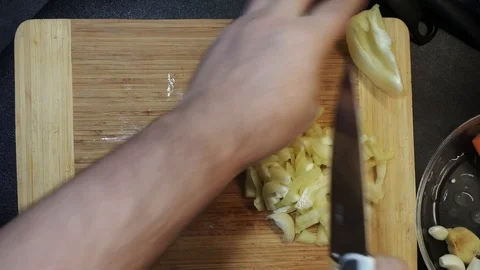 Slicing pepper overhead Stock Footage 98360687