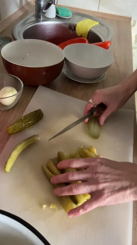Slicing Pickled Cucumbers For Salad Video stock 269363016