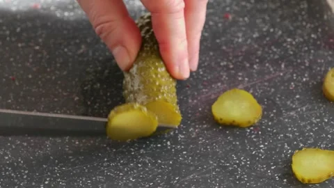 Slicing Pickles to Create Culinary Delights That Everyone Will Enjoy and Savor Stock Footage 304742778