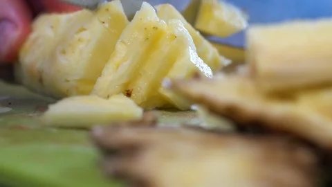 Slicing pineapples at a restaurant Stock Footage 101217470