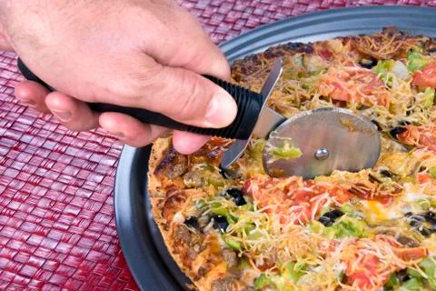 Slicing pizza Stock Photos