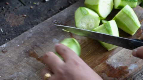 Slicing pointed gourd Stock Footage 332610946