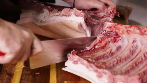 Slicing Pork Rib Stock Footage 136206353