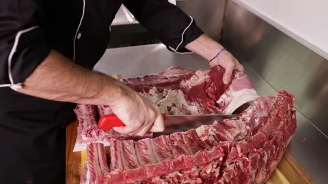 Slicing Pork Rib in the kitchen Stock Footage 248748949
