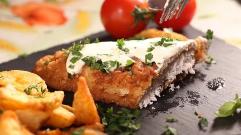 Slicing pork schnitzel Stock Footage 83182939