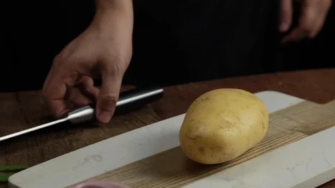 Slicing potato Stock Footage 118020046
