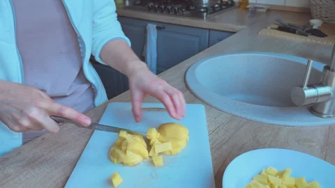 Slicing Potatoes For Soup Close Up Kitchen Cooking Preparation 스톡 동영상 336457814